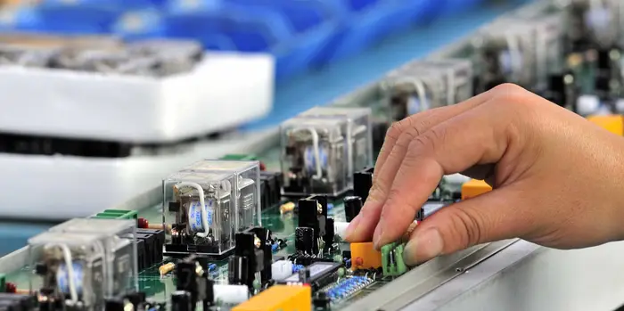 Integrated cleanroom ceiling panel with filters and lighting in semiconductor lab